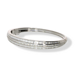 Load image into Gallery viewer, Side view of 3.07 CT natural round and straight baguette cut diamond bangle set in 18kt white gold, showcasing its elegant profile and diamond arrangement.