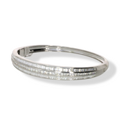 Side view of 3.07 CT natural round and straight baguette cut diamond bangle set in 18kt white gold, showcasing its elegant profile and diamond arrangement.