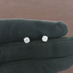 Load and play video in Gallery viewer, Video showcasing 0.68 CT natural round cut diamond stud earrings set in 18kt white gold, featuring timeless elegance and brilliant sparkle. 
