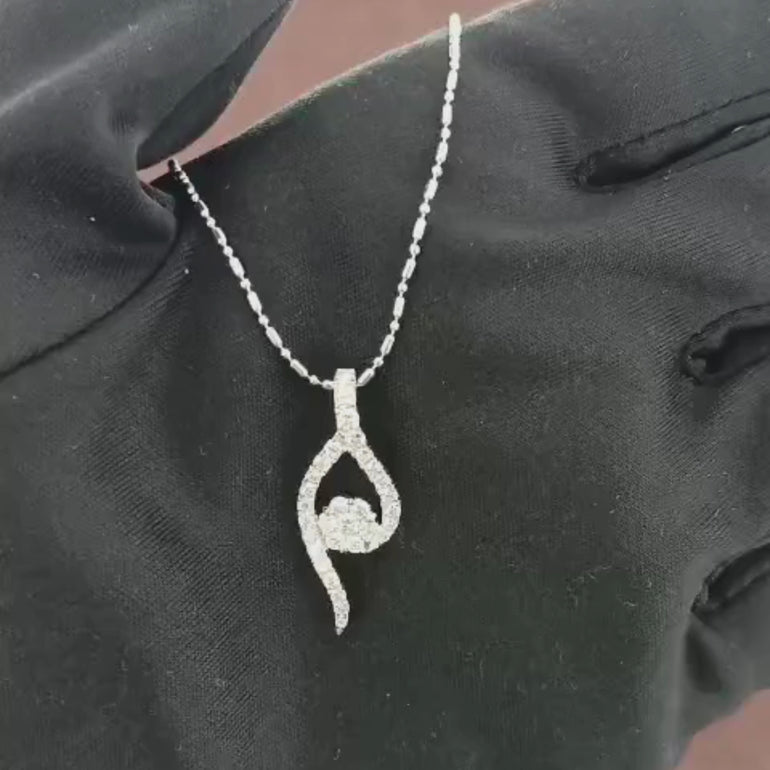 Video showcasing the 0.47 CT natural round cut diamond pendant set in 18kt white gold, highlighting the elegant design and brilliant sparkle of the round diamond in a detailed close-up.