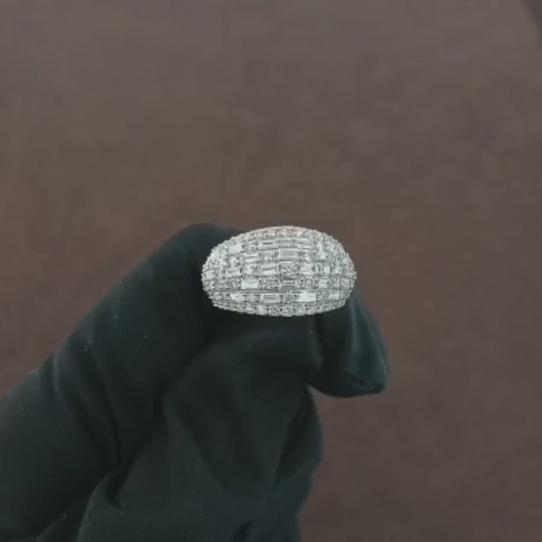 Video showcasing the 1.86 CT Natural Round & Straight Baguette Cut Diamond Ring, set in 18K white gold. Watch as the brilliant round diamonds and sleek baguette diamonds come to life, capturing light and creating a mesmerizing sparkle. Perfect for engagements, anniversaries, or special occasions, this ring exudes timeless elegance and sophistication.