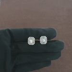 Load and play video in Gallery viewer, Video showcasing 0.69 CT natural round, straight baguette, and tapered baguette cut diamond stud earrings, highlighting the combination of diamond shapes in a sleek, sophisticated design.
