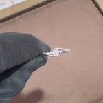 Load and play video in Gallery viewer,  video showcasing of a 0.20 carat natural round cut diamond solitaire ring. The diamond is set in a simple, classic band, emphasizing its radiant sparkle and clean design. 

