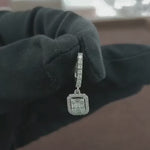 Load and play video in Gallery viewer, Video showcasing the 0.56 CT natural round and straight baguette cut diamond hoop earrings set in 18kt white gold, highlighting their elegant design and brilliant diamond sparkle.
