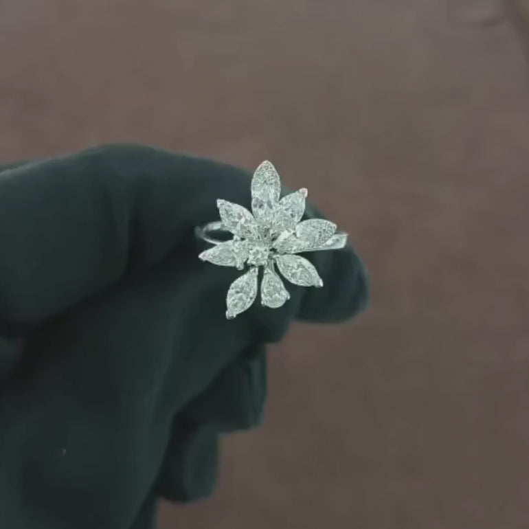 Video showcasing a 1.5 CT Natural Diamond Flower Ring, featuring Marquise, Pear, and Round Cut Diamonds in a stunning floral design, set in 18kt white gold.