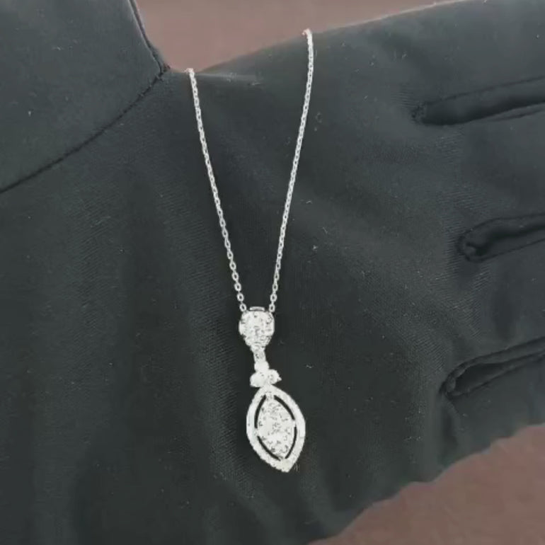 Video showcasing the 0.69 CT natural round cut diamond pendant set in 18kt white gold, highlighting the elegant design and brilliant sparkle of the round diamond in close-up view.