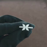 Load and play video in Gallery viewer, Video showcasing the 1.15 CT natural round and marquise cut diamond ring set in 18kt white gold, highlighting the stunning sparkle and elegant design of the round and marquise diamonds from different angles.
