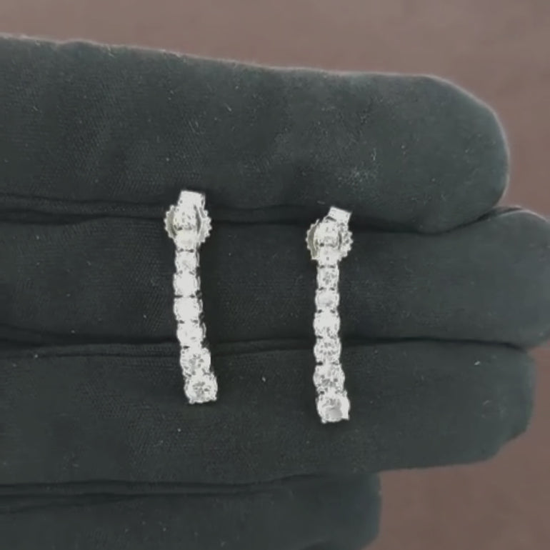 Video showcasing the 1.37 CT natural round cut diamond tennis earrings set in 18kt white gold, highlighting their elegant design and brilliant diamond sparkle.